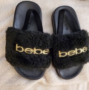 Bebe sandal size large 9/10 Black And Gold